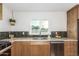 Cozy kitchen with wood cabinets, modern backsplash, and stainless steel appliances at 1345 W Edgemont Ave, Phoenix, AZ 85007