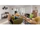 Cozy living room featuring bright light, comfortable seating and a fireplace at 1345 W Edgemont Ave, Phoenix, AZ 85007