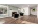 Cozy living room with fireplace, hardwood floors, and natural light at 1345 W Edgemont Ave, Phoenix, AZ 85007
