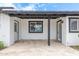 Covered patio area with tiled flooring, offering a perfect outdoor space for relaxation and entertaining at 1345 W Edgemont Ave, Phoenix, AZ 85007