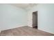 Well-lit bedroom with laminate wood flooring and closet at 143 W Desert Vista Trl, San Tan Valley, AZ 85143