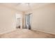 Neutral bedroom with ceiling fan, closet, and window coverings at 143 W Desert Vista Trl, San Tan Valley, AZ 85143