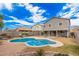 Inviting kidney-shaped pool with a paved patio and grassy area at 143 W Desert Vista Trl, San Tan Valley, AZ 85143