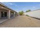 Large backyard with gravel and a small citrus tree at 14426 W Morning Star Trl, Surprise, AZ 85374