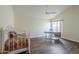 Bedroom with wood floors, a ceiling fan, and a workspace at 14426 W Morning Star Trl, Surprise, AZ 85374