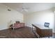 Cozy bedroom with a daybed, desk, and ceiling fan at 14426 W Morning Star Trl, Surprise, AZ 85374