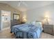 Main bedroom with two beds, nightstands, and ensuite access at 14426 W Morning Star Trl, Surprise, AZ 85374