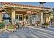 Community cafe with outdoor seating and potted plants at 14426 W Morning Star Trl, Surprise, AZ 85374