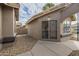 Home's exterior features a security door and gravel landscaping at 14426 W Morning Star Trl, Surprise, AZ 85374