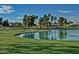 Stunning golf course with a lake and beautiful landscaping at 14426 W Morning Star Trl, Surprise, AZ 85374