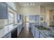 Spacious kitchen with island, stainless steel appliances, and granite countertops at 14426 W Morning Star Trl, Surprise, AZ 85374