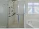 Walk-in shower with grab bars and a glass enclosure at 14426 W Morning Star Trl, Surprise, AZ 85374