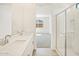Bathroom featuring a shower with glass doors and double sinks at 16023 W Desert Hollow Dr, Surprise, AZ 85387