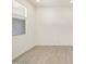 Neutral-colored room with tile floor and window at 16023 W Desert Hollow Dr, Surprise, AZ 85387
