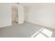 Spacious bedroom boasts neutral carpet and an ensuite bathroom at 16023 W Desert Hollow Dr, Surprise, AZ 85387
