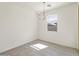 Bright dining room featuring contemporary chandelier and tile flooring at 16023 W Desert Hollow Dr, Surprise, AZ 85387