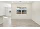 Dining area showcasing an adjacent kitchen area and natural lighting at 16023 W Desert Hollow Dr, Surprise, AZ 85387