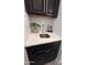 Stylish bar area featuring granite counters, white subway tile, and stainless steel sink at 2835 E Los Gatos Dr, Phoenix, AZ 85050