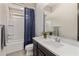Well-lit bathroom featuring modern vanity, toilet, and shower-tub combination at 2835 E Los Gatos Dr, Phoenix, AZ 85050