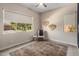 Bright bedroom with large window overlooking the driveway and natural light at 2835 E Los Gatos Dr, Phoenix, AZ 85050