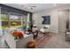 Cozy living room with a sofa, armchairs, and sliding glass doors leading to the backyard at 2835 E Los Gatos Dr, Phoenix, AZ 85050