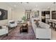 Open living room with comfortable seating, stylish rug, and views to the kitchen at 2835 E Los Gatos Dr, Phoenix, AZ 85050