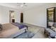 Bright main bedroom with tiled flooring, ensuite bathroom, and walk out access at 2835 E Los Gatos Dr, Phoenix, AZ 85050