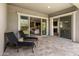 Relaxing outdoor patio with travertine tile, lounge chairs and easy access to indoor living spaces at 2835 E Los Gatos Dr, Phoenix, AZ 85050