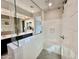 A stylish walk-in shower with white subway tile, a built-in bench, and sleek fixtures at 2835 E Los Gatos Dr, Phoenix, AZ 85050