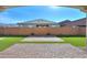 Landscaped backyard with patio and artificial turf at 3919 W Hayduk Rd, Laveen, AZ 85339