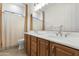 Elegant bathroom with double sinks, tiled floor, and updated fixtures at 4516 S Jojoba Way, Chandler, AZ 85248