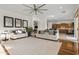 Bright and airy living room with two sofas and a view into the kitchen at 4516 S Jojoba Way, Chandler, AZ 85248