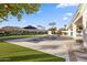 Luxury pool area with expansive patio and lush landscaping at 4516 S Jojoba Way, Chandler, AZ 85248