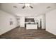 Open concept living room and kitchen with wood-look floors and lots of natural light at 659 W Pintail Dr, Casa Grande, AZ 85122