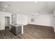 Spacious open-concept living room with kitchen and multiple entry points at 659 W Pintail Dr, Casa Grande, AZ 85122