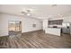Spacious living room with wood-look floors and sliding glass doors to the backyard at 659 W Pintail Dr, Casa Grande, AZ 85122