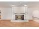 Close-up view of a fireplace with a brass screen and built-in shelving at 707 S Cactus Wren St, Gilbert, AZ 85296