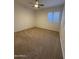 Bright bedroom with neutral carpeting and ceiling fan at 8724 E Nopal Cir, Mesa, AZ 85209