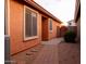 Brick walkway leading to a side gate and backyard at 8724 E Nopal Cir, Mesa, AZ 85209