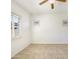 This bedroom features tile floors, a window with shutter, and a large closet at 10559 E Simone Ave, Mesa, AZ 85212