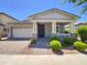 Charming single-story home with a well-manicured front yard and inviting covered porch at 10559 E Simone Ave, Mesa, AZ 85212
