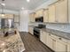 Well-equipped kitchen with stainless steel appliances, granite countertops, and custom cabinetry at 10559 E Simone Ave, Mesa, AZ 85212