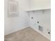 Tiled laundry room features built in shelf and all necessary connections for modern appliances at 10559 E Simone Ave, Mesa, AZ 85212