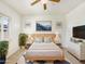 Bright main bedroom with a neutral palette and large windows offering lots of natural light at 10559 E Simone Ave, Mesa, AZ 85212