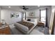 Cozy main bedroom with a ceiling fan, neutral decor, and ample natural light at 12635 N Sun Valley Dr, Sun City, AZ 85351