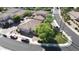An aerial view showcases a single-Gathering home in a well-maintained neighborhood with mature trees at 13613 W Cypress St, Goodyear, AZ 85395