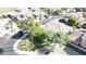 Aerial view showcases a landscaped yard and neighborhood streets at 13613 W Cypress St, Goodyear, AZ 85395