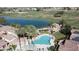 Aerial view displays community pool, lake, and the golf course at 13613 W Cypress St, Goodyear, AZ 85395