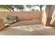 Landscaped backyard with gravel, cactus, and block wall at 13613 W Cypress St, Goodyear, AZ 85395