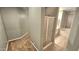 Bathroom with shower, tub and tile floors at 13613 W Cypress St, Goodyear, AZ 85395